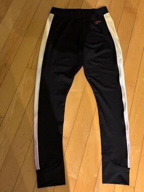 Sophia Webster PUMA black sports leggings with light yellow and purple stripes